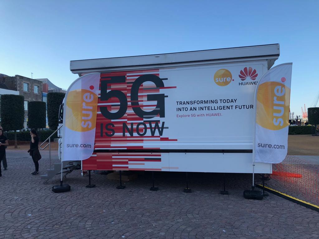 SureJersey's tweet photo. Our 5G exhibition truck is all set up at Weighbridge Place. We've brought the @Huawei exhibition to the island to demonstrate some of the capabilities of 5G and get people thinking about its possible uses and how the technology can benefit Jersey. #5GShowcase https://t.co/wKd1RgWOnk