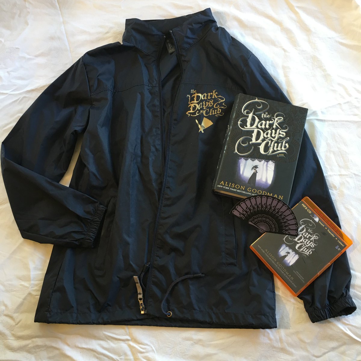 PixelProject's tweet photo. New York Times bestselling YA Fantasy author @AlisonGoodman has a magical #DarkDaysClub goodie bundle stuffed full of exclusive collectibles for 1 generous #Read4Pixels donor. Donate to get it now via https://t.co/6vZ7AHaO68 and help keep our anti-VAW work alive! #VAW https://t.co/fNqzviqu2C