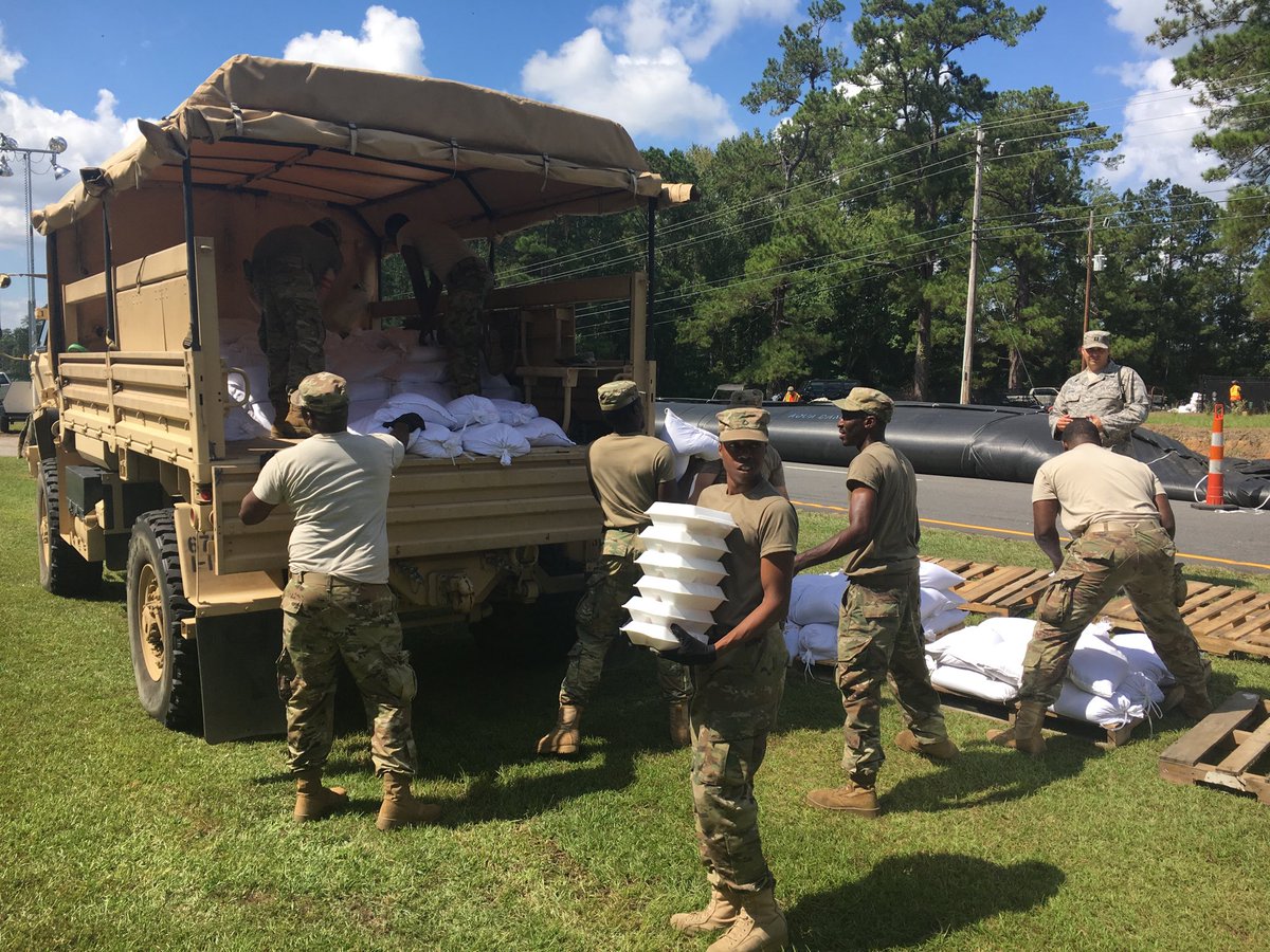SC Guard Soldiers unloading 500 sandbags for the Aqua Dam on Hwy 17.  #CitizenSoldiers