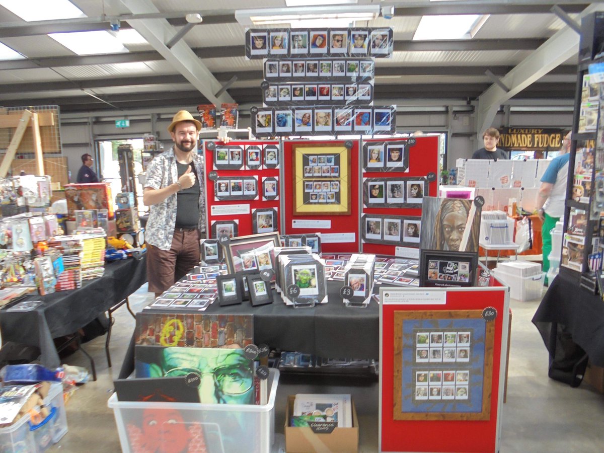 Look who else is going to be at our Christmas Market! 
This is Dom, an artist and currently his stock mainly consists of 'superhero' polaroids. He usually trades at comic cons... but we’ve snapped him up for our market!! 

Here’s a photo of him with his stall at Newark!