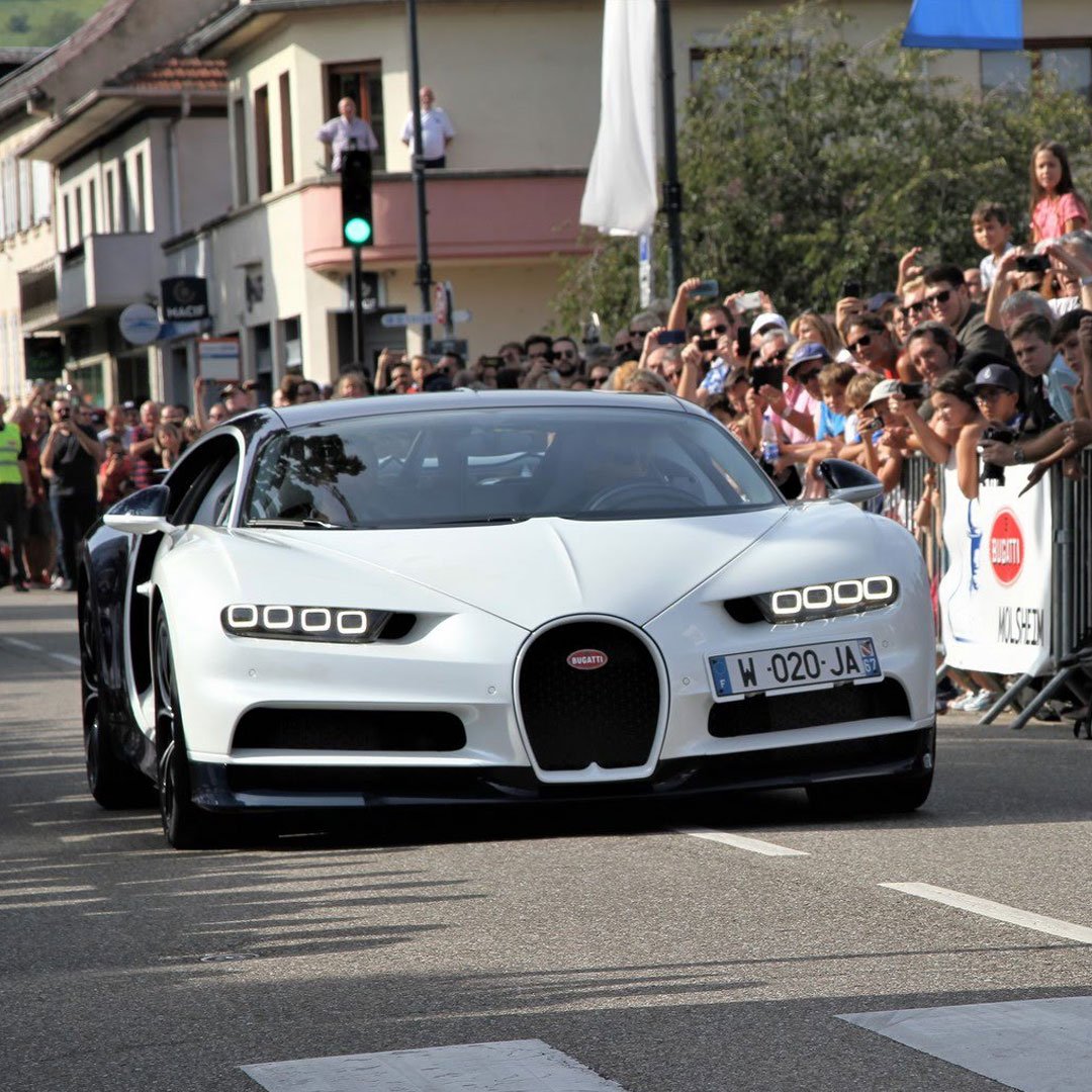 Bugatti's tweet photo. Once a year Bugattisti celebrate the revival of the brand at Molsheim/France, the venue where Ettore founded the factory in 1909. #Bugatti #MolsheimFestival Photo credit: Pierre Vieuille https://t.co/mBmTxF3P7k
