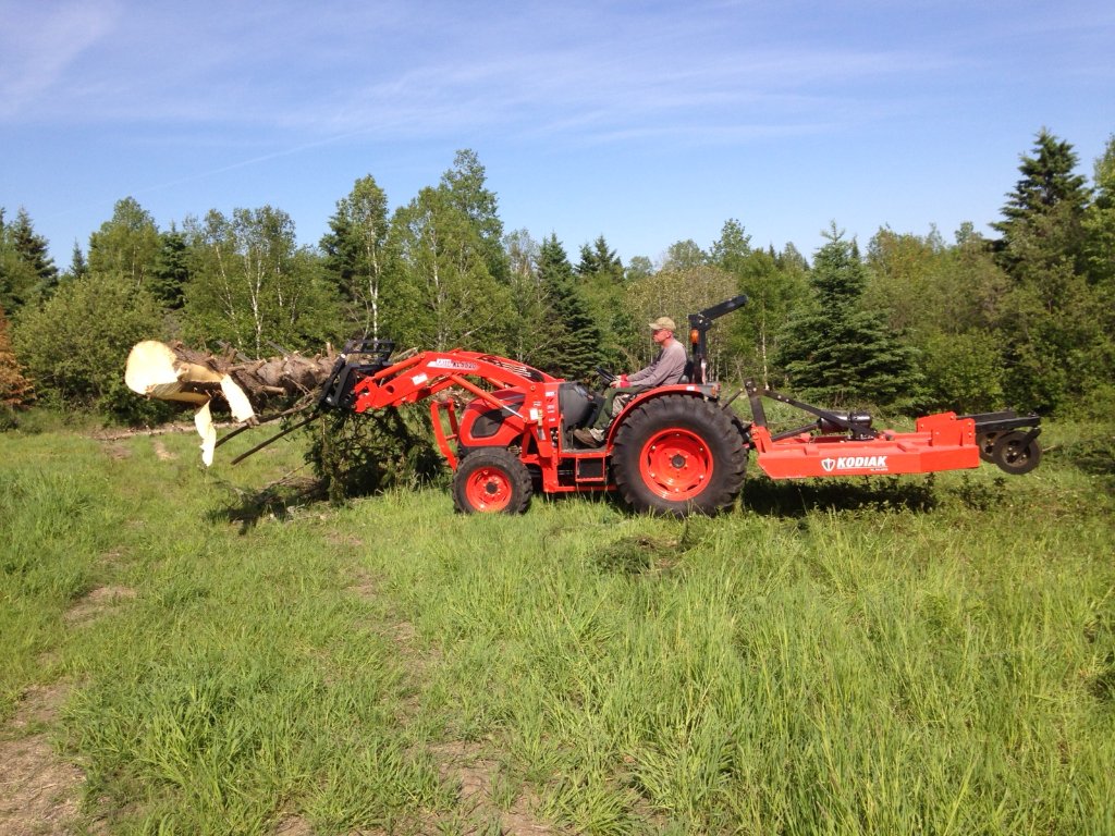 Here are some happy #Artillian customers in Maine working their new 3000 lb capacity #skidsteer #forkframe with a backrest and 48X4” #palletforks on a #Kioti. They like the longer forks for moving trees and brush and getting their work up and off the ground.