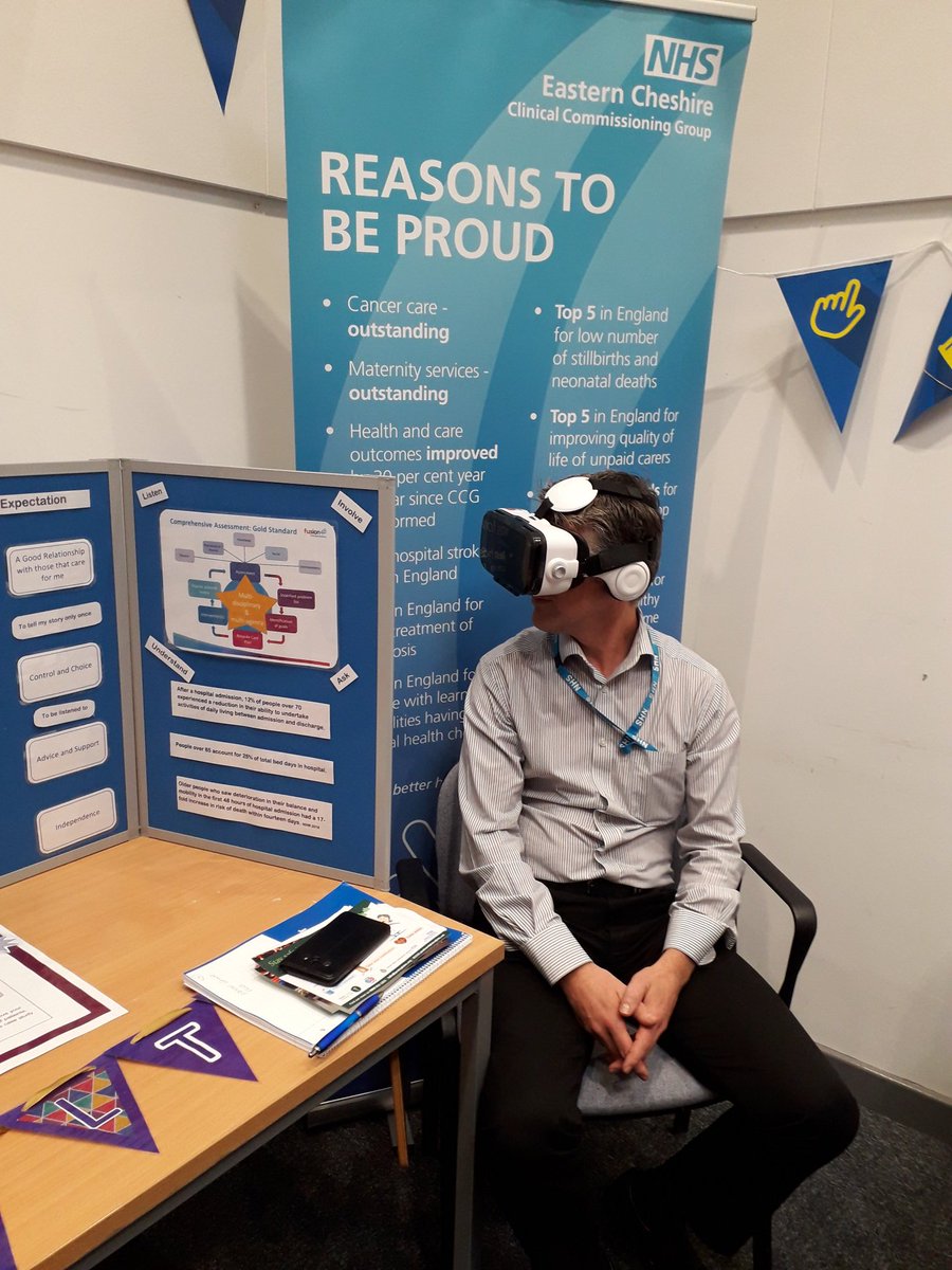 ACPFrailtyCarol's tweet photo. Lots of stands and @NHSECCCG Dean Grice trying out the virtual reality at the #frailty stand with Caroline. A fantastic way to experience how sone older people live. @Fusion48net https://t.co/z8rB2GelHq