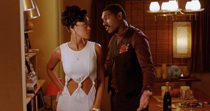 Robin (Lela Rochon)"Robin, the sex pot, is fire--the most provocative-looking of the quartet in red lace demi bra, tight orange halter dress and lots of bare midriff."