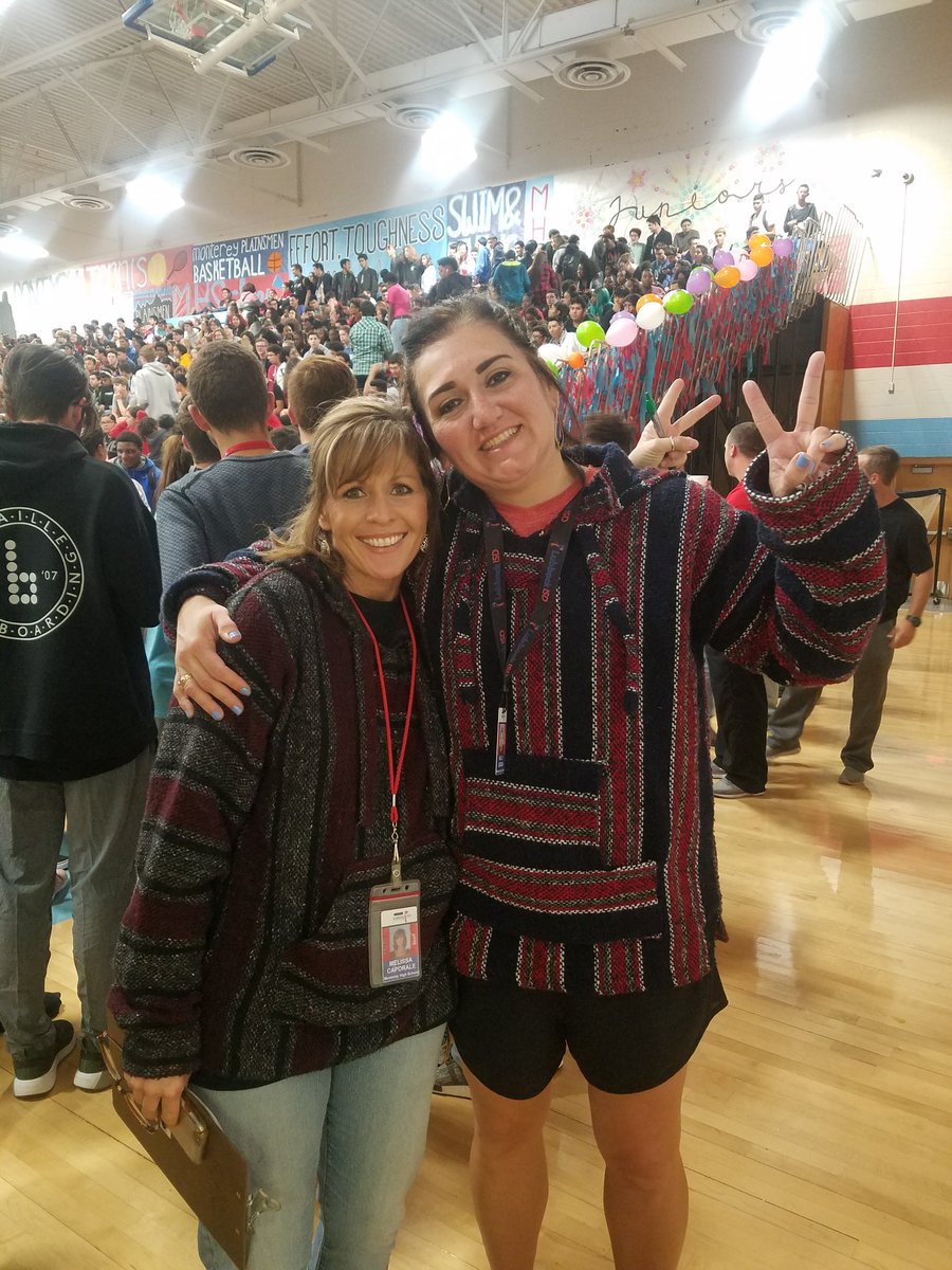 CoachKLozada's tweet photo. Our fearless athletic secretary Missy and I #twinning for our fiesta pep rally. @mhsplainsmenfb kick off district to ight at 7pm at Plains Capital Park. #GoPlainsmen #BeatemRed #BeatemBlue https://t.co/EXHMUp6UtZ