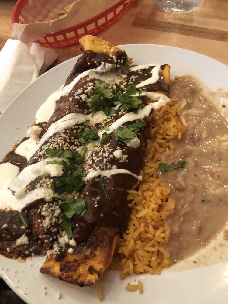 Have you tried our Pollo en Mole? 

 📷 yelp: Katy B.