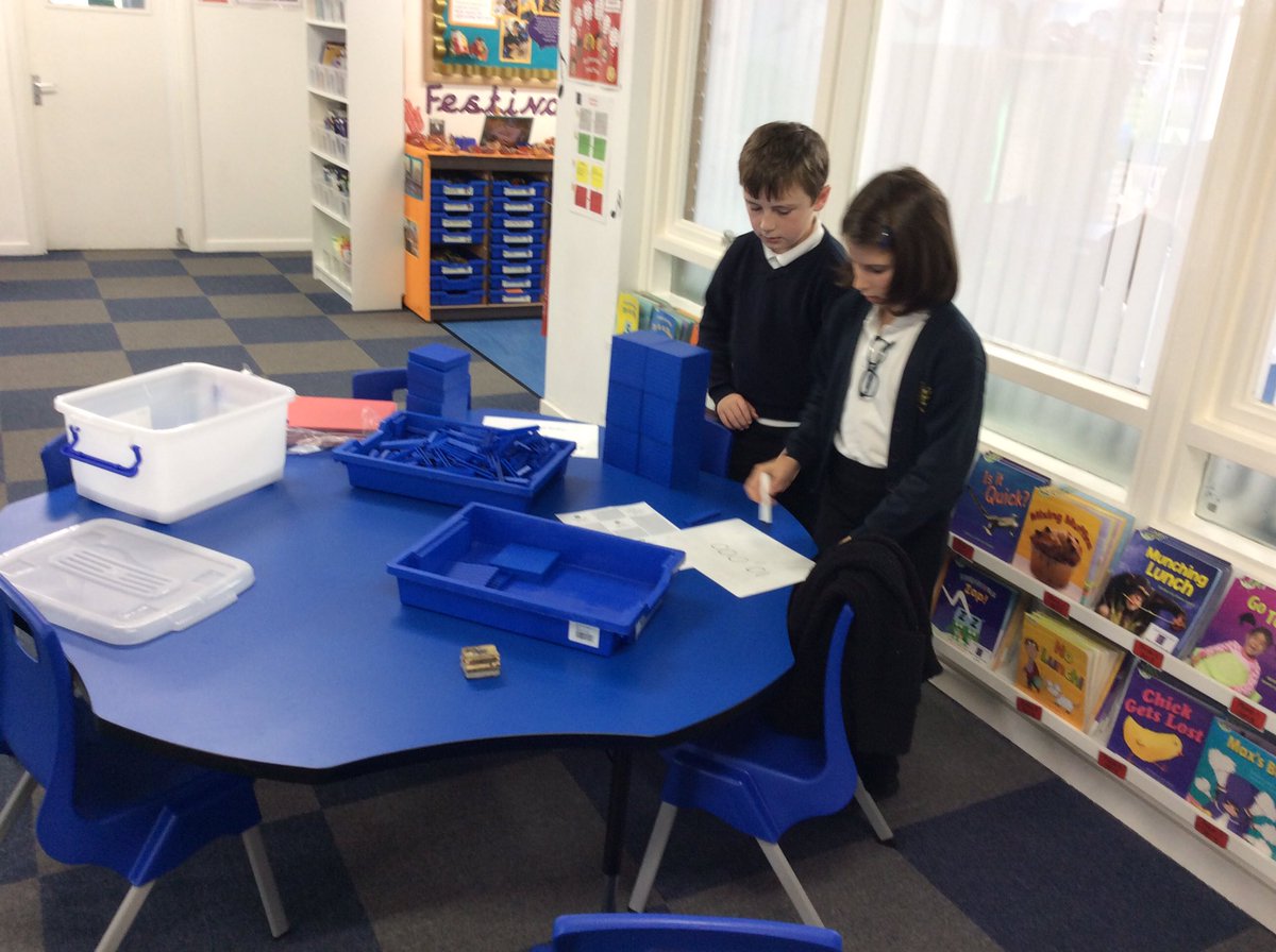CamblesSchool's tweet photo. Collaboration to solve the button factory problem today! These two didn't want to hear the answer from their peers because they were determined to solve it themselves so they went outside to work on their challenge @WhiteRoseMaths #amazingmathematicians https://t.co/c7yTb3BIpk