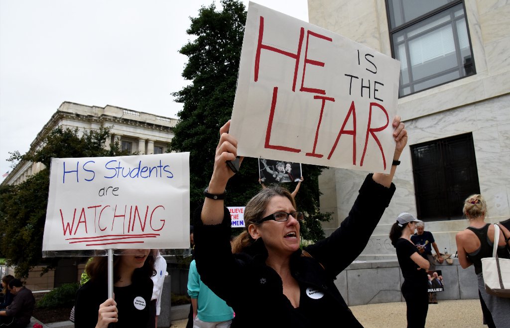 latimes's tweet photo. If you're checking in for an update while the hearing is on break, you can find our latest coverage here: https://t.co/p5VVSEAGXt

Here are scenes from the day in Washington so far: https://t.co/qToW3p4FhI