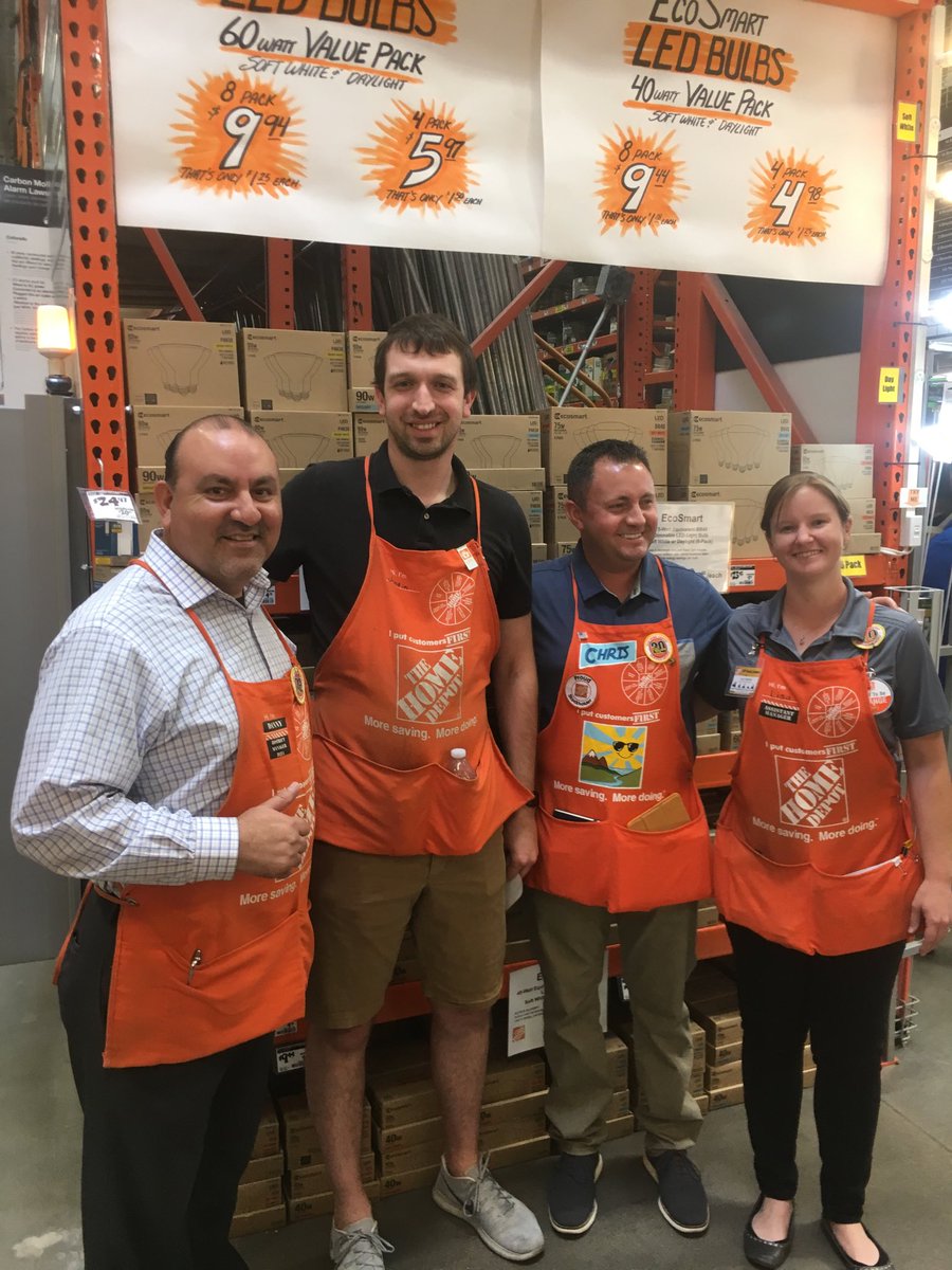 Chris FDMM Western Division recognizing Justin associate from D27 from store 1508 for driving creativity on end Cap with top bulk Light Bulb skus.