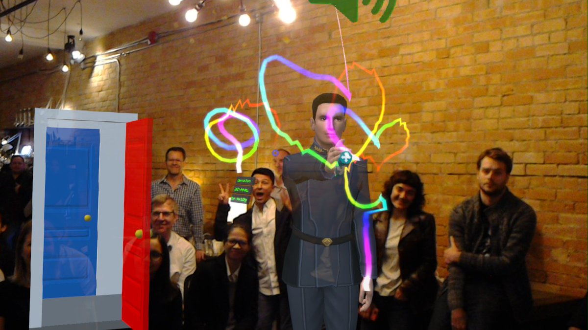 skyzdev's tweet photo. Sean's finger painting in front the audience &amp; his perspective of me presenting in #MixedReality at #AWENiteTO https://t.co/TRCCNHTaH9