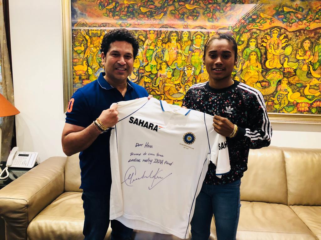 HimaDas8's tweet photo. An overwhelming morning, meeting my legend i always looked upon @sachin_rt sir #dreamcometrue #memorablemorning Thanks sir for this memorable jersey and some motivational talks which will really help me in my career. https://t.co/rNMpAOoq3R