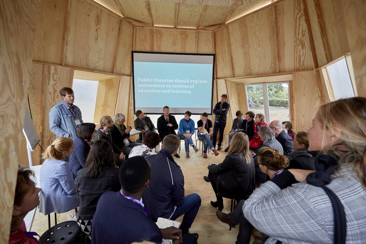 p2pu's tweet photo. Public Libraries Should Replace Universities as Centres of Education and Learning! Agree or Disagree? We hosted a provocative participatory debate on this exact topic with librarians from across the world @nextlibrarycrew #learningcircles #nextlibraryberlin © Mike Auerbach / ZLB https://t.co/kA15Alxiat