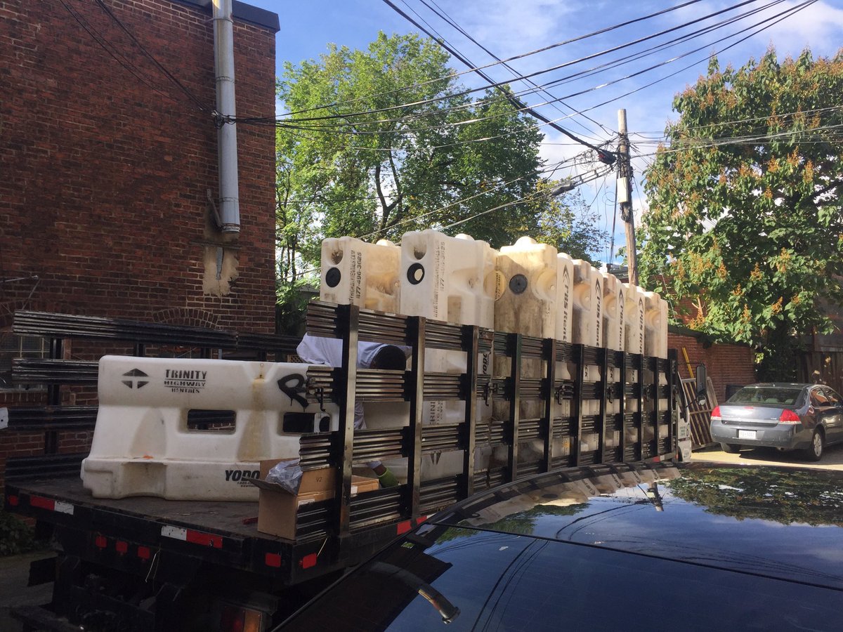 BarracksRow's tweet photo. And so it begins! First delivery of the day before #BRFallFest - water barriers to block off the street in the morning! https://t.co/EjcR0ylhia