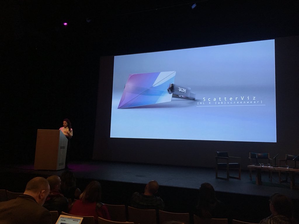elly_clarke's tweet photo. A scarf with AI-recognisable faces on it and a micro aggression deflection visa: 2  of several products + VR experiences developed &amp; marketed by @hyphen_labs in defence + protest of racialised (racist) technologies - presented by Romy Gad el Rab #messyedge @DigitalBrighton https://t.co/4lbpmEXDpg