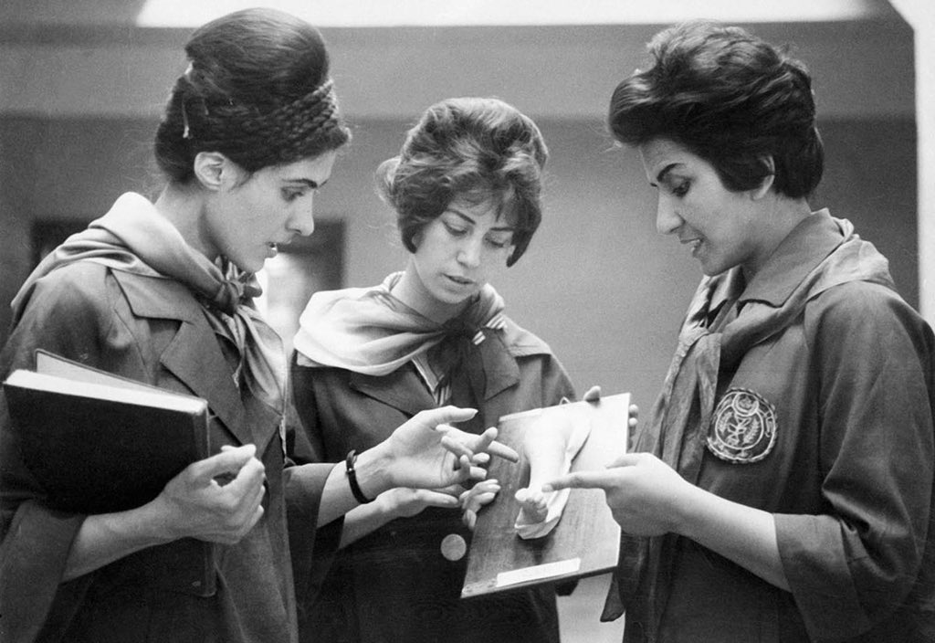 OldHistoryPics_'s tweet photo. Picture taken in 1962 at the Faculty of Medicine in #Kabul of two Afghan medicine students listening to their professor (at right) as they examine a plaster cast showing a part of a human body. #History https://t.co/XQss1fQHeD