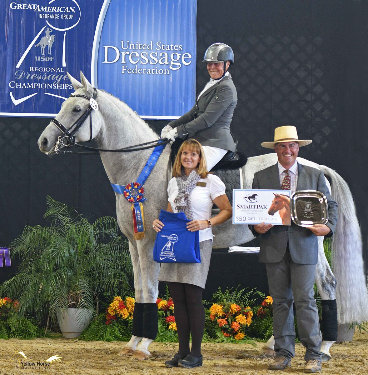 USDF's tweet photo. She’s a 75-year-old Olympian who still rides close to 20 horses a day. And on the first day of the Great American Insurance Group/USDF Region 7 Championships, Hilda Gurney once again found the winner’s circle – and her joy. Read more here: https://t.co/Iz4TjwtfnG https://t.co/68W5FgHyrc
