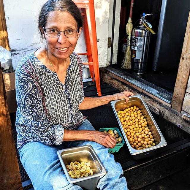 DesiPDX's tweet photo. Mom's in the house shucking some @thesideyardfarm ground cherries. She loved my dhal. 😄❤️ #desipdx #modernindian #farmtocart https://t.co/kvY3bOm52t