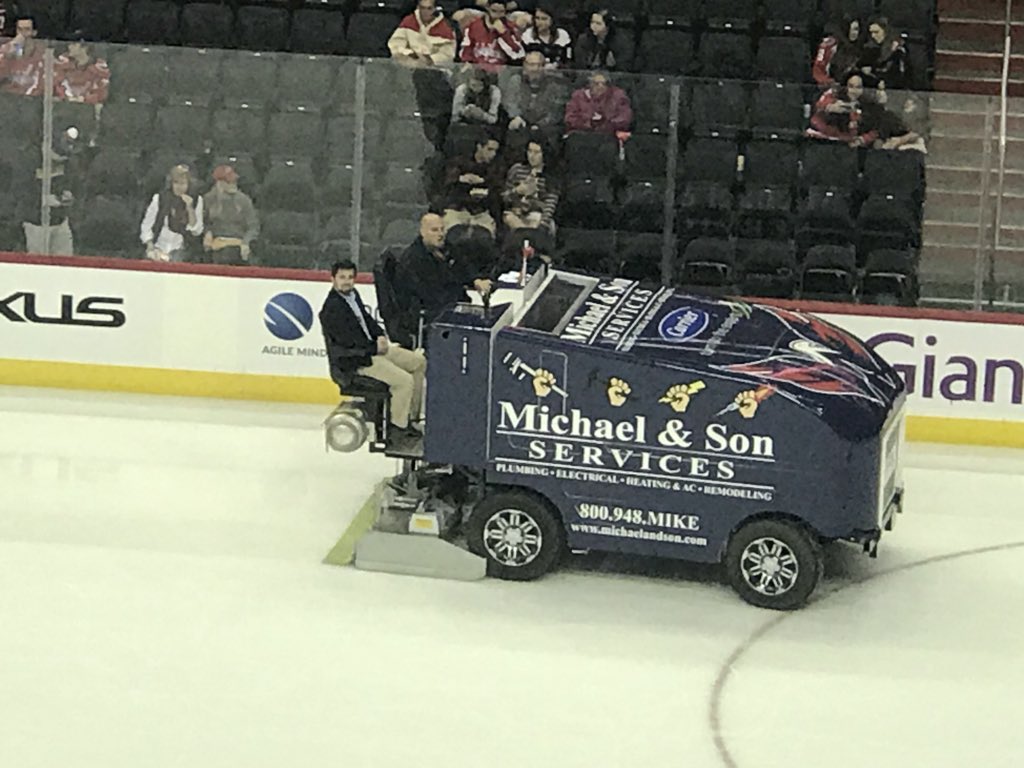 GWhockey's tweet photo. Captain Will Yerk gets a ride on the Zamboni between periods of Caps-Canes as he gets ready for tonight’s tilt vs Georgetown. If you’re at @CapitalOneArena, make sure you stick around for the double header! #RaiseHigh https://t.co/TzVlZ3Qhby