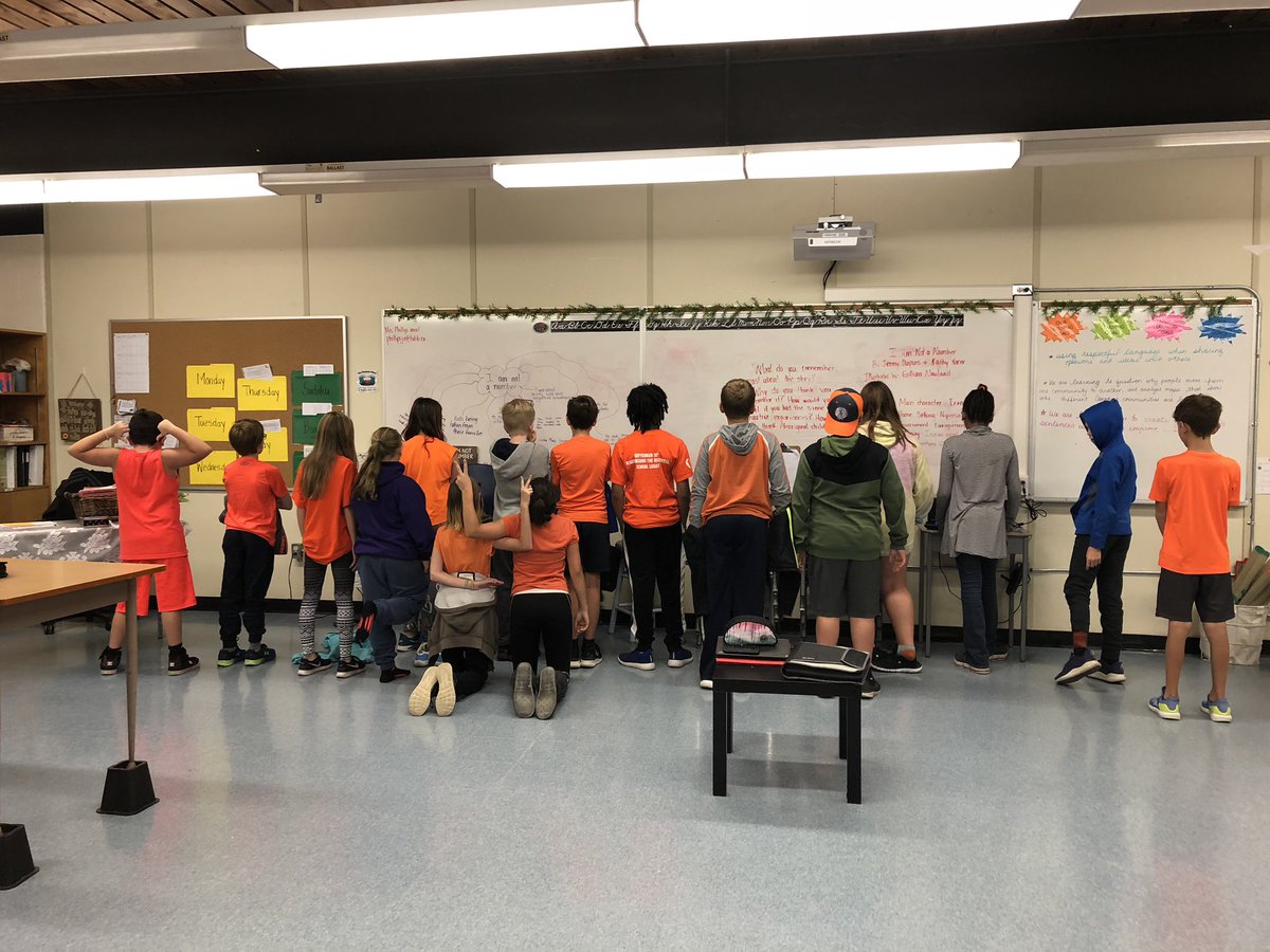 MsJPhil's tweet photo. Some @CentChargers standing proud in their orange today to remember victims and survivors of residential schools while also showing an interest in their learning content! #proudteachermoment https://t.co/TmEDrIMrpC