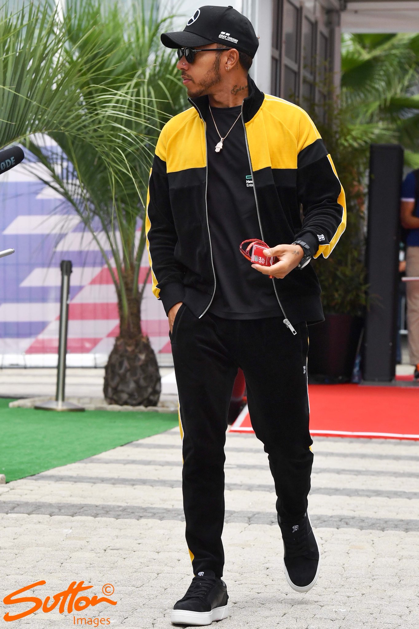 Lewis Hamilton dons a £3,800 Louis Vuitton tailored tracksuit at