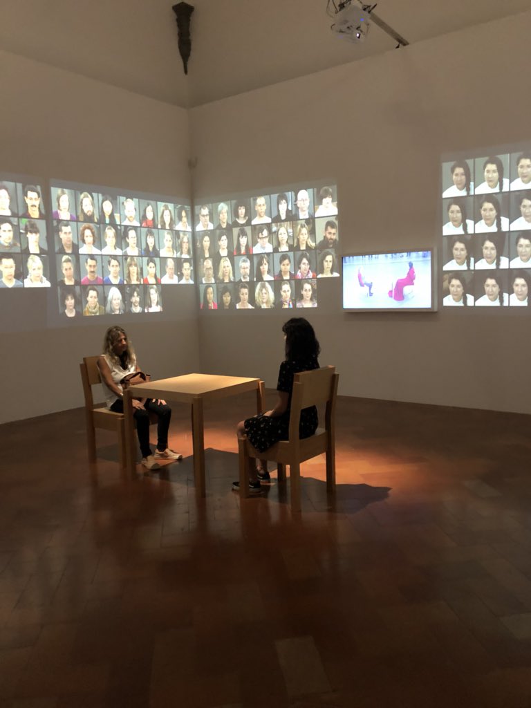 Sandranatuno80's tweet photo. "Un tavolo e due sedie. È molto semplice. Non c’è quasi niente. C’è solo l’artista che sta là come una montagna. Una roccia. E ti guarda negli occhi" #marinaabramovic #firenze2018 https://t.co/nv29WJJjST