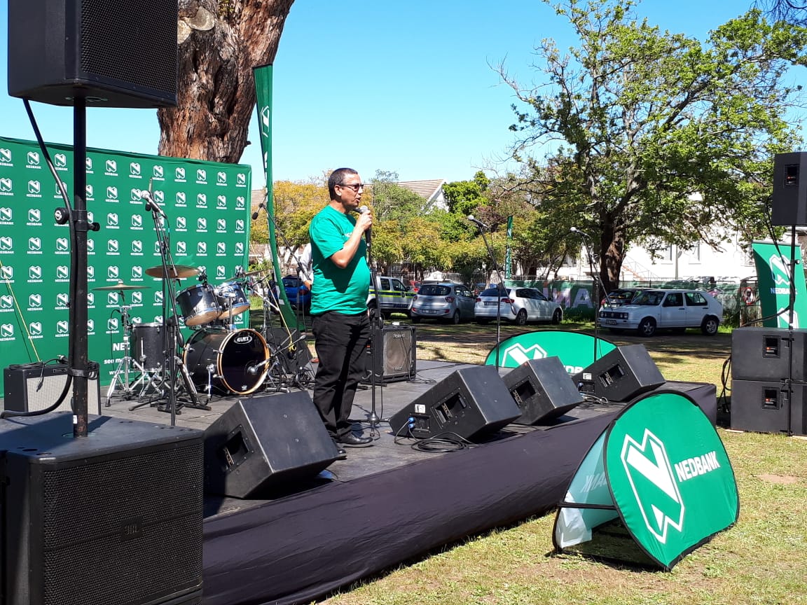 Nedbank's tweet photo. Nedbank Winelands District Regional Manager, Naziem Esack, introduces the Proud About My Town initiative at today's E'Bosch Festival of Talents in Stellenbosch. #ProudAboutMyTown #Stellenbosch #EBosch #EarlyChildhoodDevelopment https://t.co/NSXVi70C9P