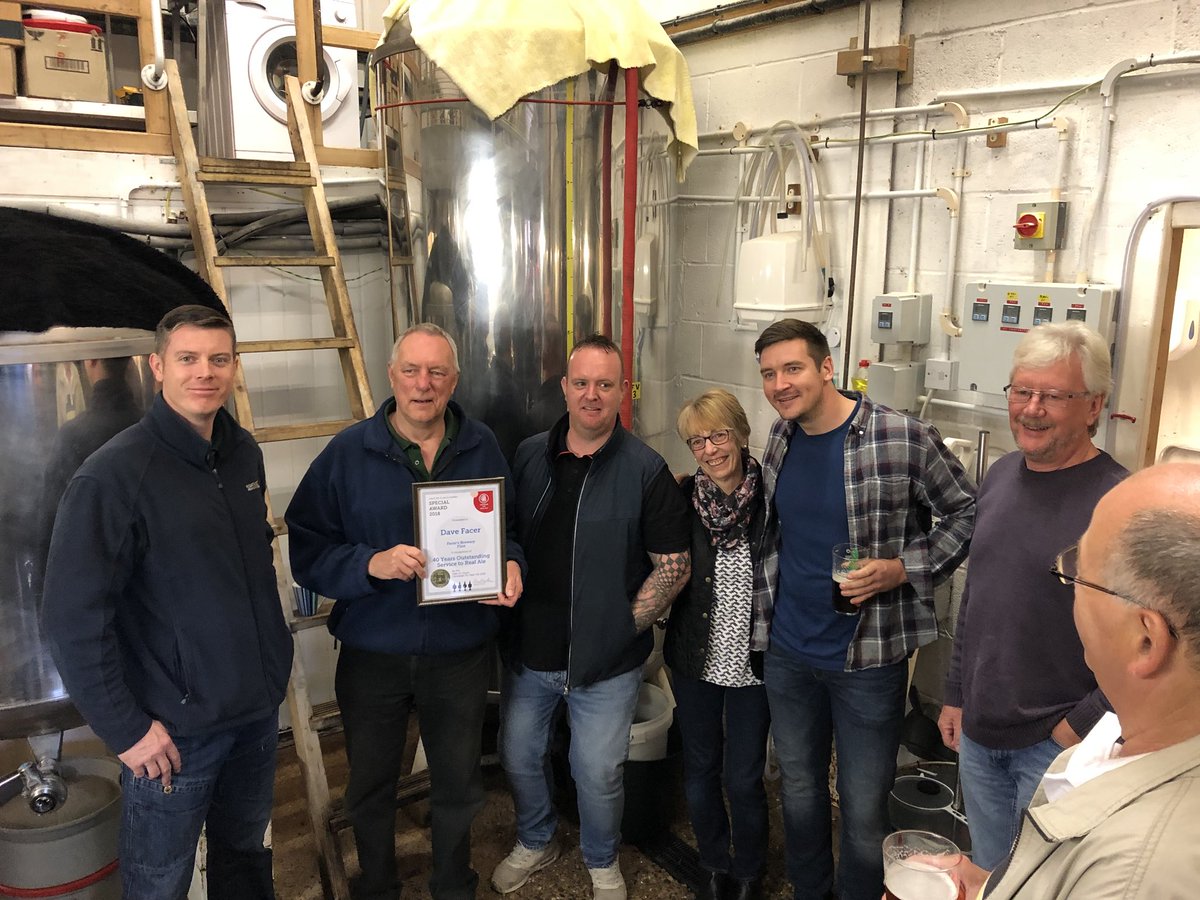ClwydCAMRA's tweet photo. The special award was presented to Dave Facer at the brewery on 22/9. The award recognises a career over 49 years brewing real ale and his retirement with Facers Brewery now under new ownership. Pictured are Dave Facer with new owner Toby Dunn and the rest of the brewery team. https://t.co/HBGxLCpMXt