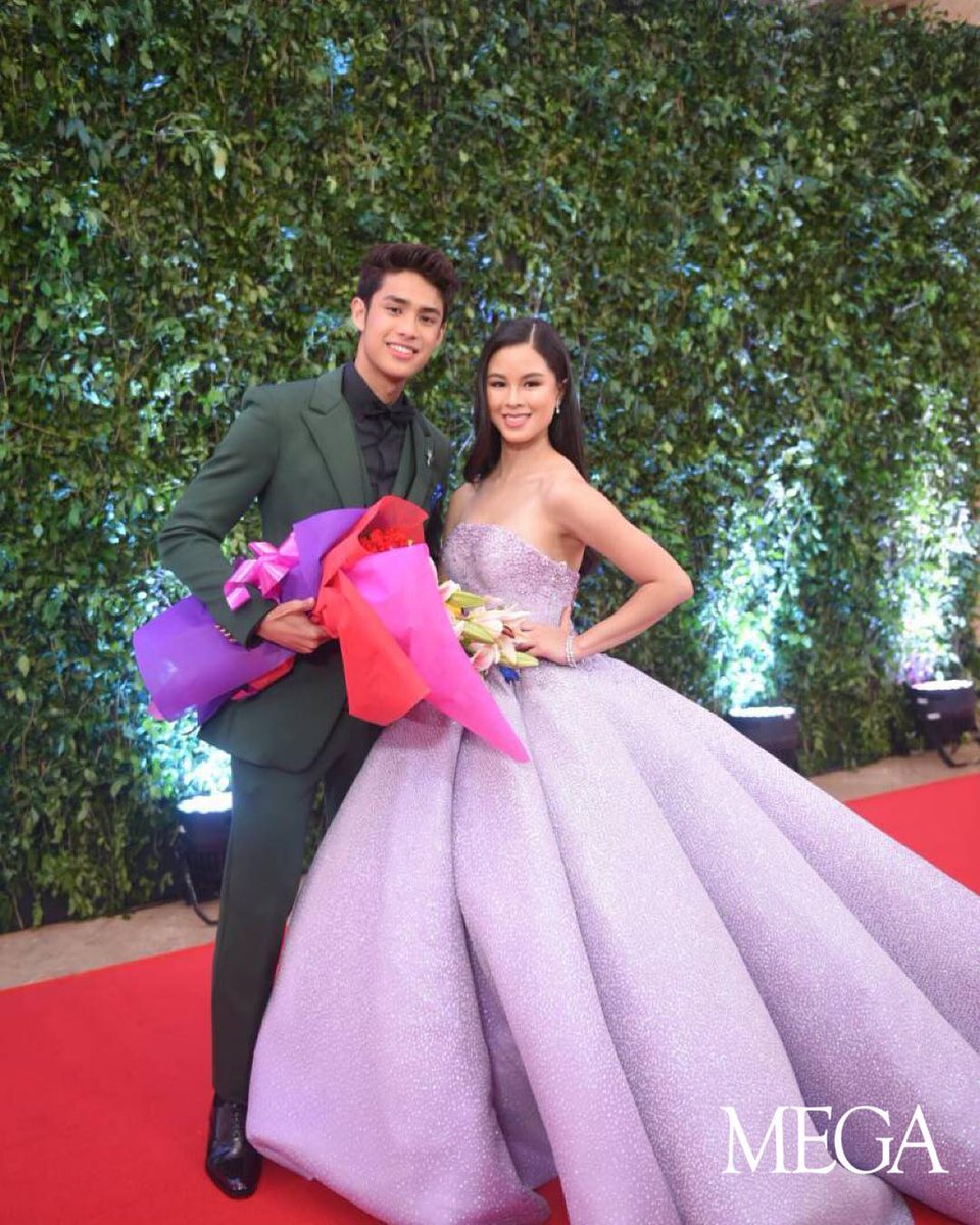 mega_magazine's tweet photo. @delavinkisses looked stunning in a pink @FrancisLibiran8 ball gown together with @donnypangilinan in a dashing moss green suit. #ABSCBNBall2018 https://t.co/qS6lmh5RTF