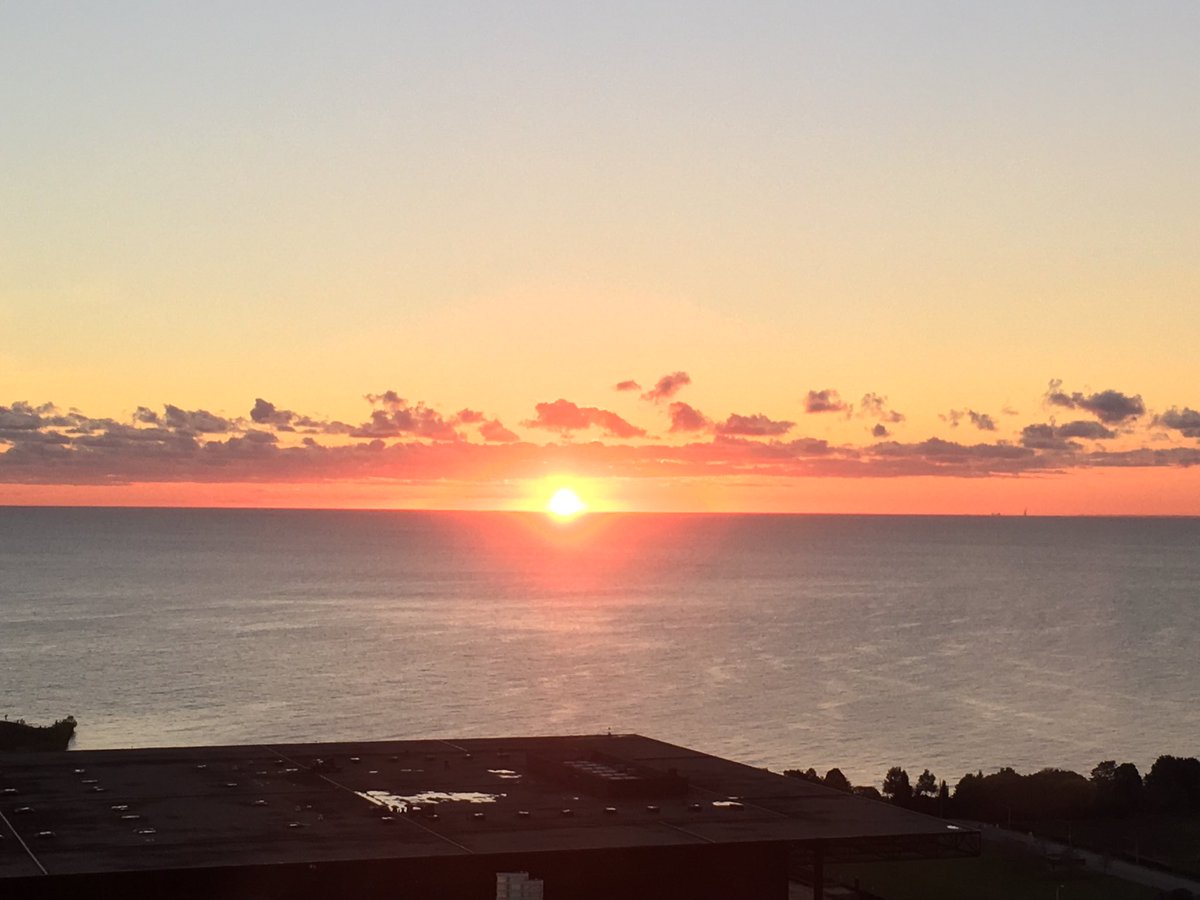 kkilga's tweet photo. Sunrise over McCormick Place. It’s a beautiful day to finish setting up for #PRINT18! Come see tomorrow! https://t.co/e5yrFupzxi