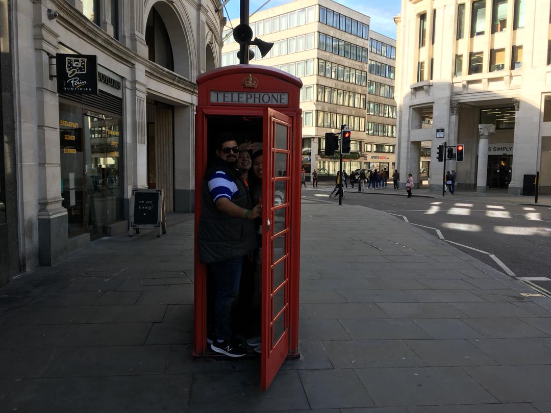 ErikaHiramatsu's tweet photo. Getting nice and cozy in a telephone box! #teamunicornsatthesouthgate @apprenticeTB https://t.co/SPXmEaEtE3