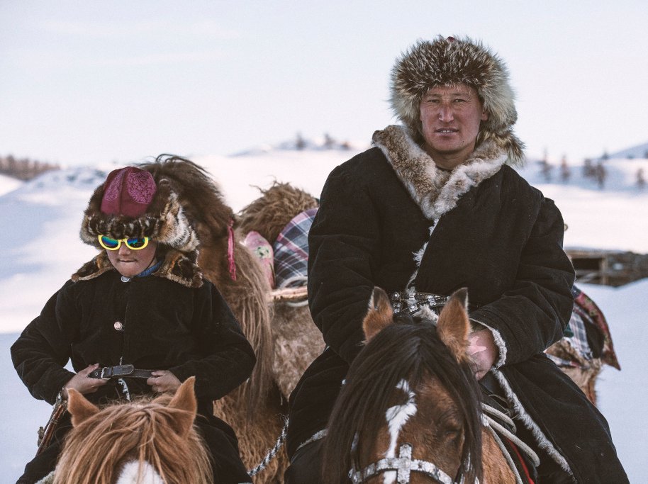Equustheseries's tweet photo. This is Janibek and his father Auez. They know how to ride through a Mongolian winter and look good doing it. Get to know them and their way of life as horse nomads this Sunday on @cbcdocs #EquusDoc #Horses #nomad https://t.co/61tvkbrxcU