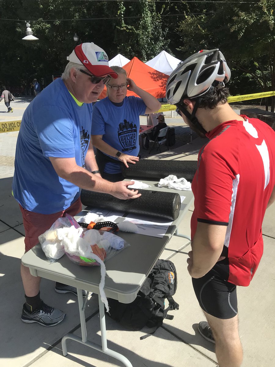 BikeArlington's tweet photo. @TSFRacing holding down the fort at the Arlington Mill Community Center where riders are learning to pack wounds and filling up their water bins. #DRTArlington #ARLPrep2018 #NATLPrep #ArlingtonBikes #dcbikes https://t.co/X4Hvu8Bv1t