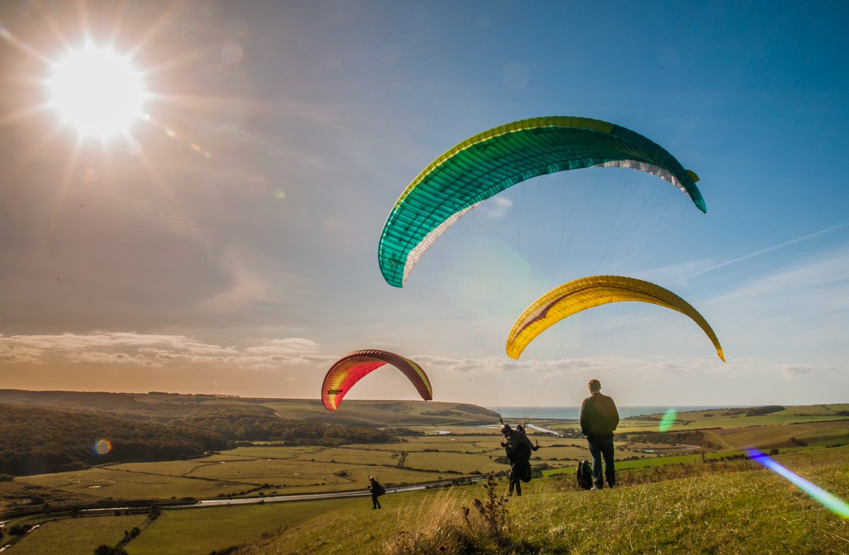 Bur1Burr's tweet photo. #Paragliders #Paragliding at #HighAndOver #Seaford #Litlington over the #Cuckmere River valley #Sussex UK . David Burr #Alamy live newsfeed https://t.co/C2beBlyMdT