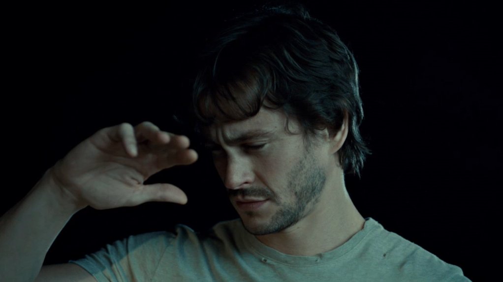 beatricenius's tweet photo. Is there anything softer than sleepy and confused Will Graham shielding his little face from the bright lights of a police car? I know he's really pretty buff but then his face looks like this and,, what is this man https://t.co/jt4rrZnesk