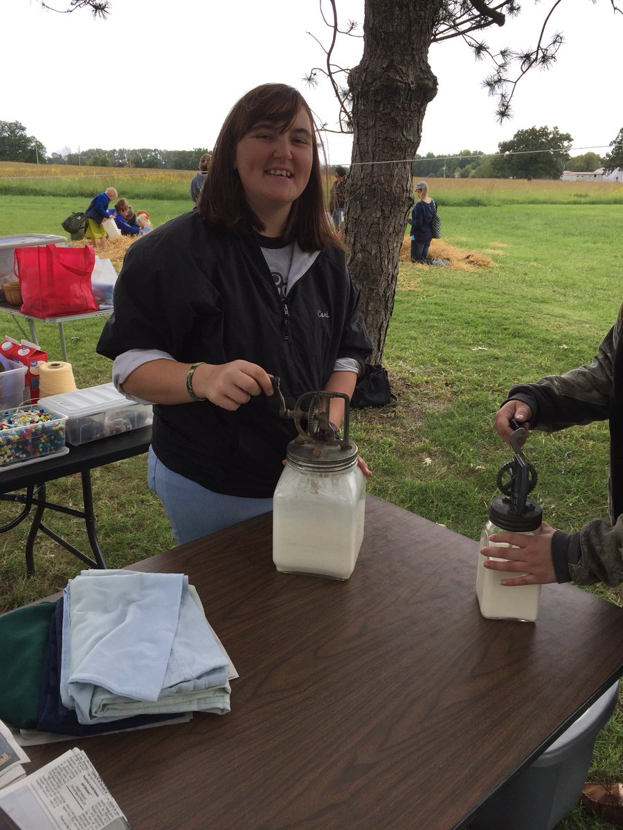 DJMTeach's tweet photo. Corianna Stewart makes butter the old-fashioned way during the 150th Howe House celebration!  @ESU_SocSciences #howehousecelebration https://t.co/Bk2x4WC4RT