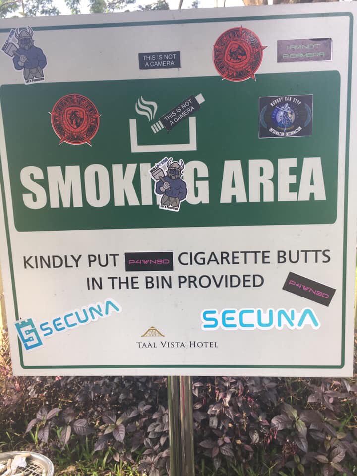 rootconorg's tweet photo. the smoking area sign during ROOTCON 12 #rootcon #rootcon12 #stickerlife https://t.co/thDpvHYL0Z