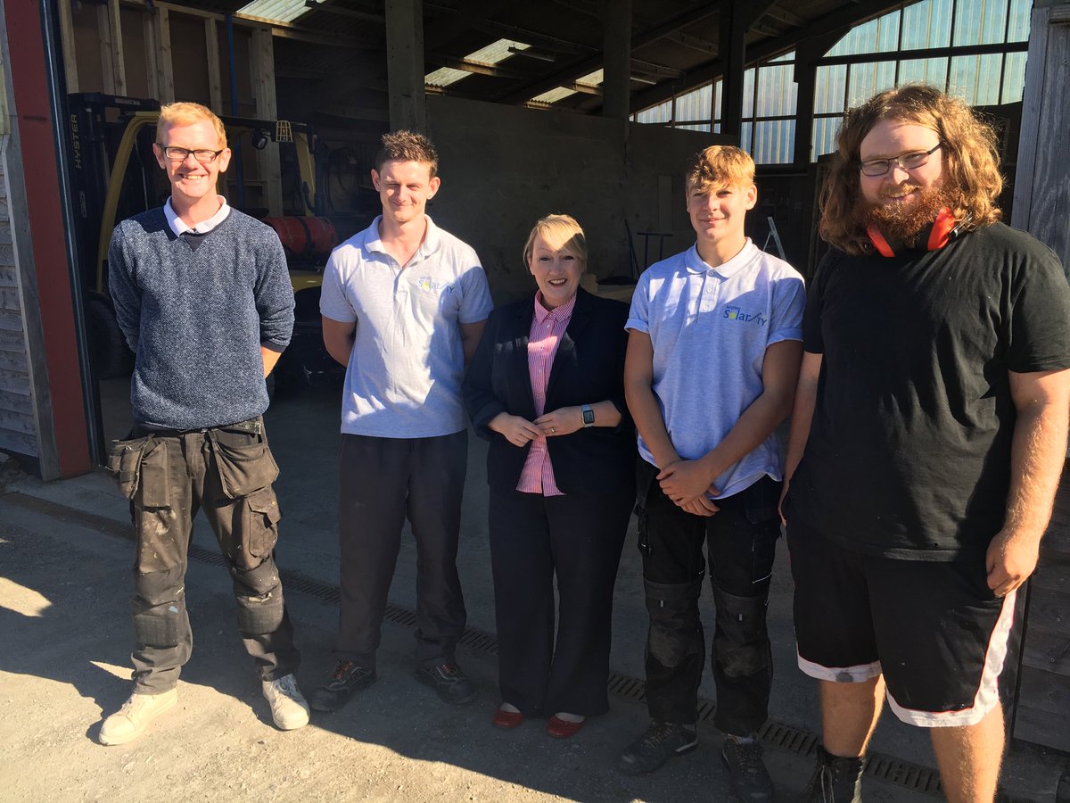 Solarhamlet's tweet photo. Housing Minister Rebecca Evans MP came to visit our factory last week. Pictured here with apprentices Tai, Olly, Nigel and Paul (mentor). https://t.co/oMfEvAIhY3