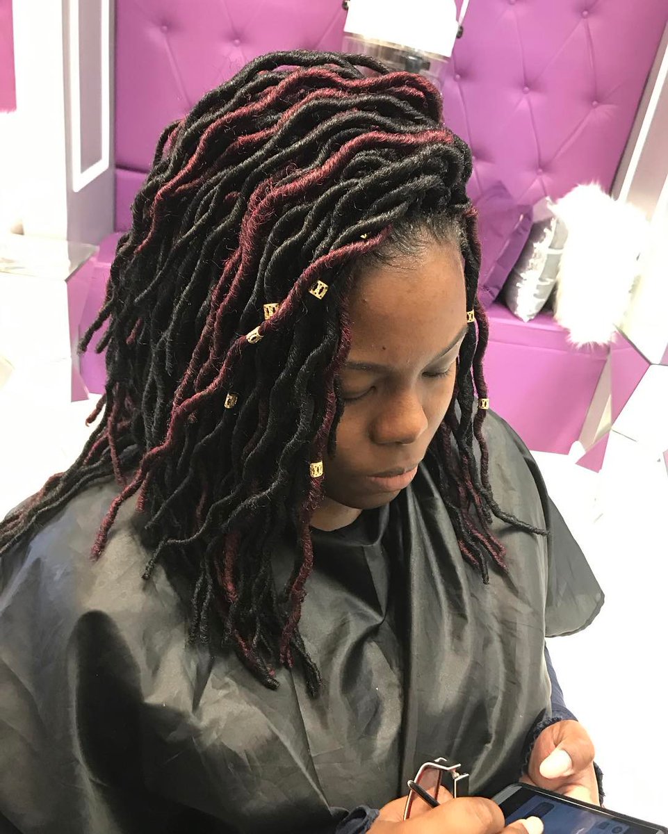 Burgundy Highlighted Locs You can construct a highlighted effect on your lo...