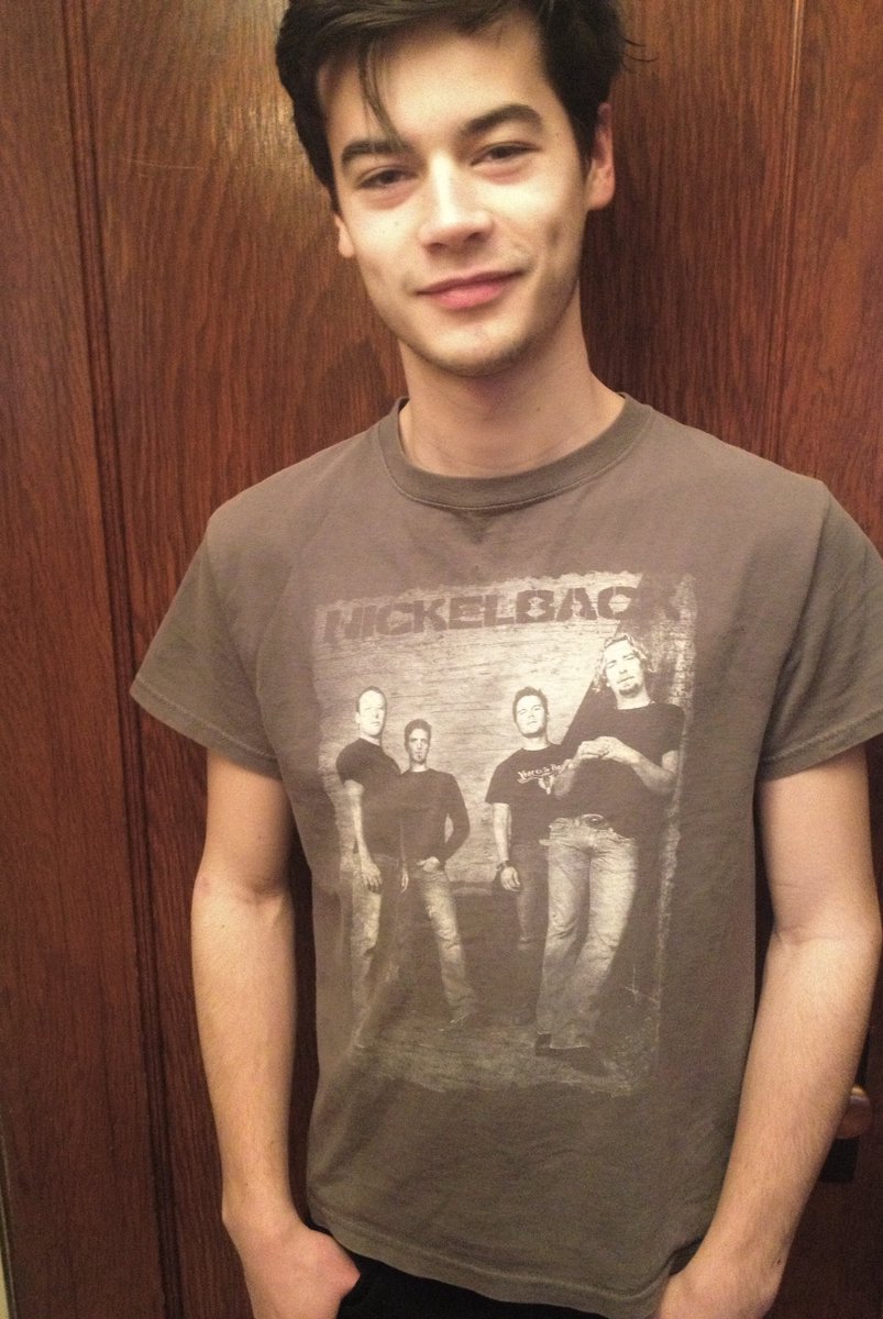 riverradcliffe's tweet photo. Look at this photograph. Clearly I’m never afraid to tell people @Nickelback was the first concert I ever attended at the Molson Amp circa 2005!! (FYI this shirt has every lyric to “Rockstar” on the back) #radriver #humberblitz https://t.co/30PMIYd2rx