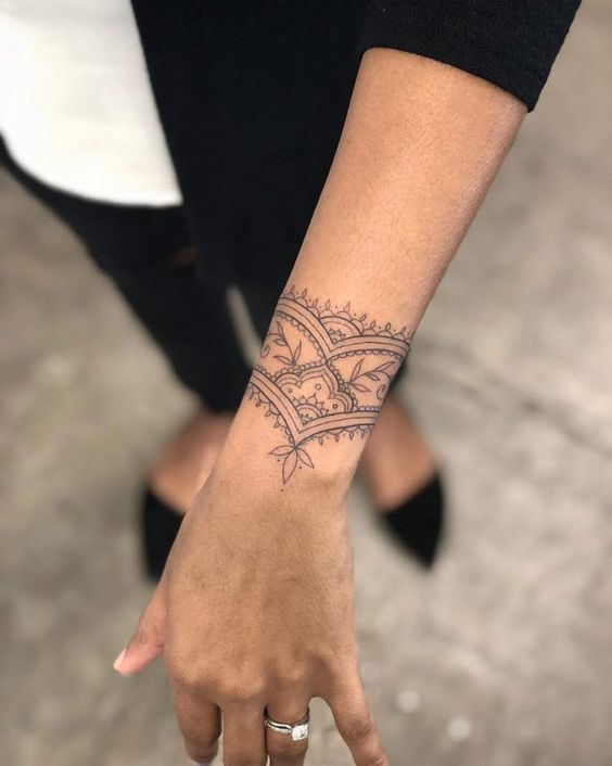 Name with flower bracelet tattoo Artist :- Kabir . . . #flowertattoo #tattoo  #tattoos #flowers #ink #tattooartist #inked #floraltattoo… | Instagram
