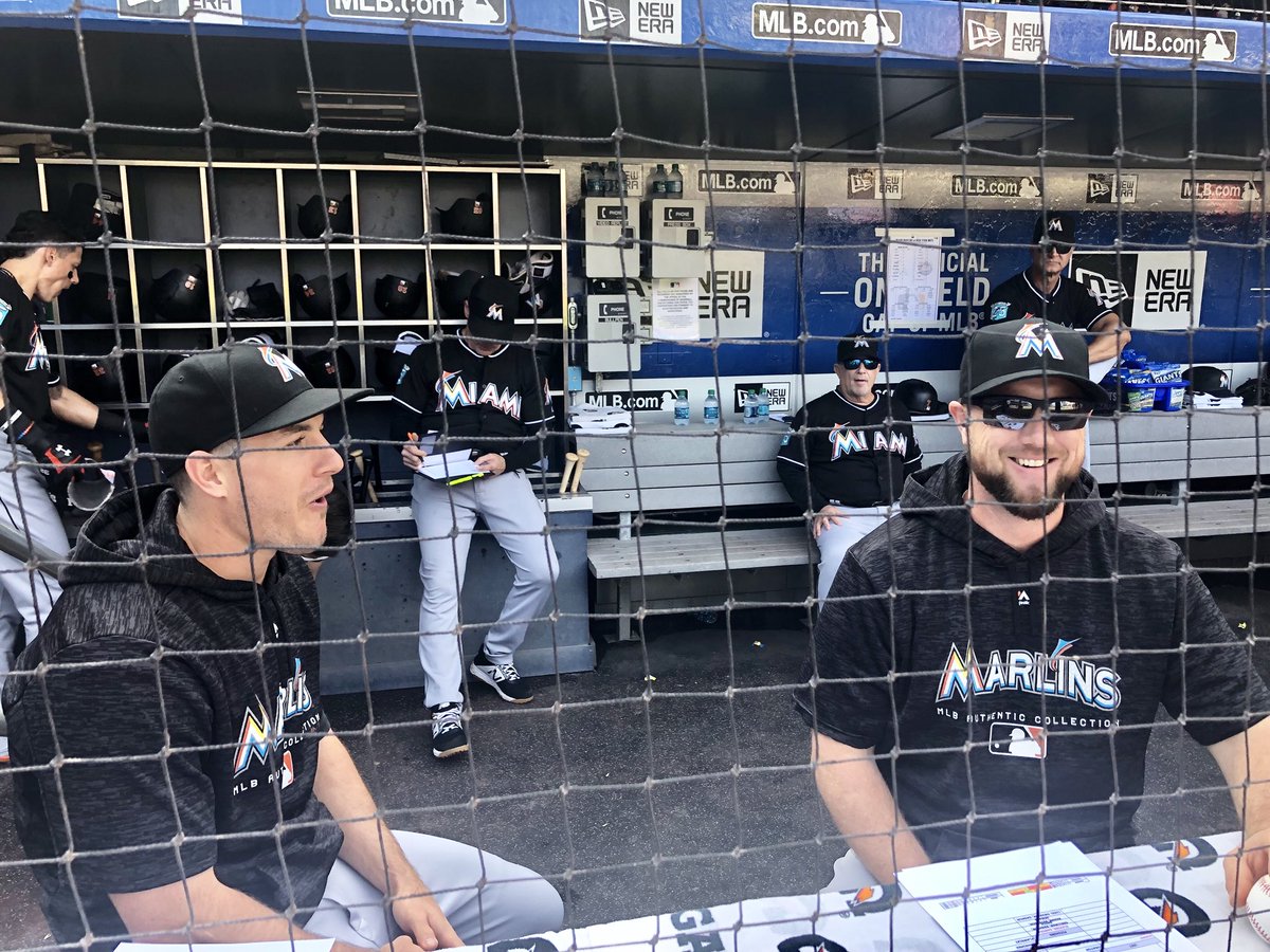 Marlins's tweet photo. Get you some men who can do both. 

J.T. Realmuto: Manager 📋
Bryan Holaday: Bench coach 🛋
Miguel Rojas: Hitting coach 🥊
José Ureña: Pitching coach ⚾️

#Game161 https://t.co/TvBoIiQZ5c