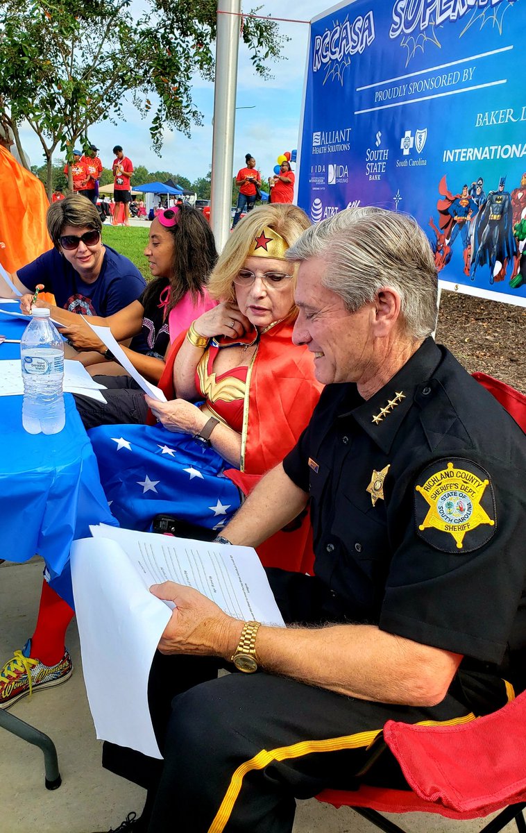 RCSD's tweet photo. Sheriff #LeonLott and Sr. Deputy Garo Brown attended the RCCASA Superhero 5k to judge the superhero costume contest. It was a great program for a great cause! @BrownGaro #communitypolicing https://t.co/nE3FZR5A43