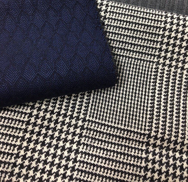 W_Halstead1875's tweet photo. Delighted to share our enthusiasm for #WoolWeek as key trends are seen in our #merinowool. Black &amp; white Prince of Wales check made from a heavy count yarn for suiting &amp; coating. Alongside a micro leaf jacquard in a full thicker #yarn to create a large motif. @Campaignforwool https://t.co/cr7pH9Yr6k