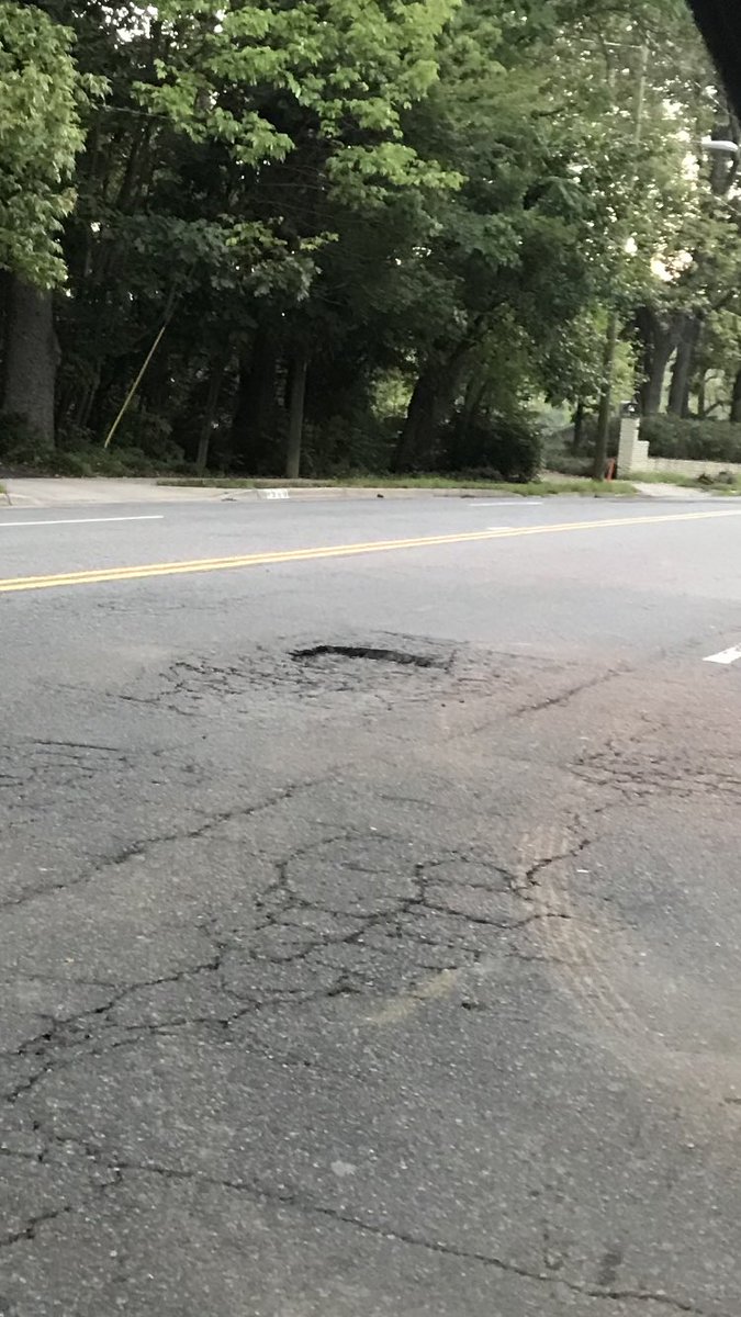 uscjake's tweet photo. @CLTgov Huge pothole caused major alignment damage to my car. 1500 block If Runnymede. https://t.co/r7ErpFphtR