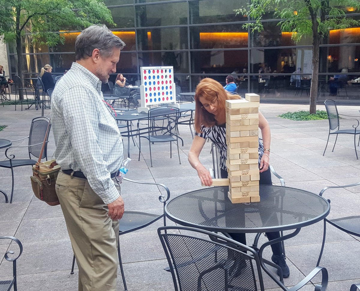 OneAmerica's tweet photo. We're halfway through our fundraising campaign for @uwci, so we celebrated today with BIG games and a beautiful afternoon in our #Indy tower courtyard. #OneAmericaCares #UWCIGameOn https://t.co/w7F3rl4LPf