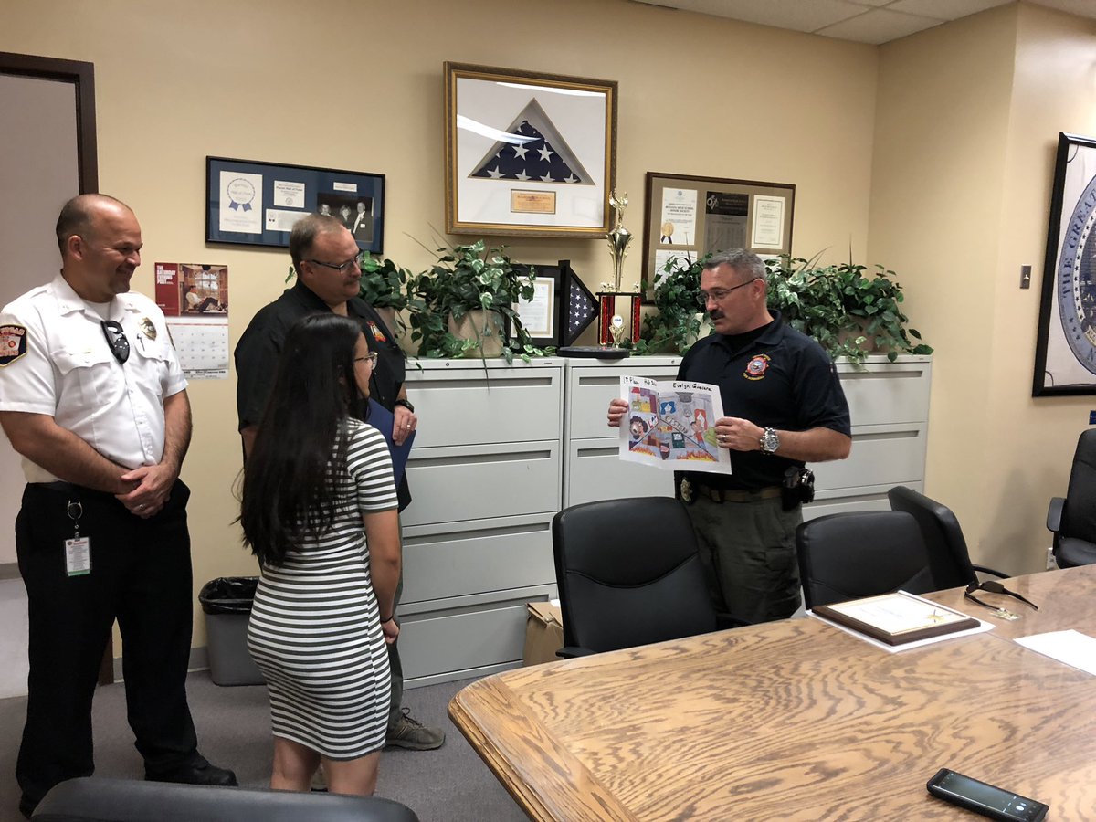 Battecm's tweet photo. Fire Science Academy student receiving her 1st place award for @NevadaDPS fire prevention week poster contest! She will have her poster on billboards all over @ClarkCountyNV and @NVGovernment https://t.co/6WrWuZRkKa