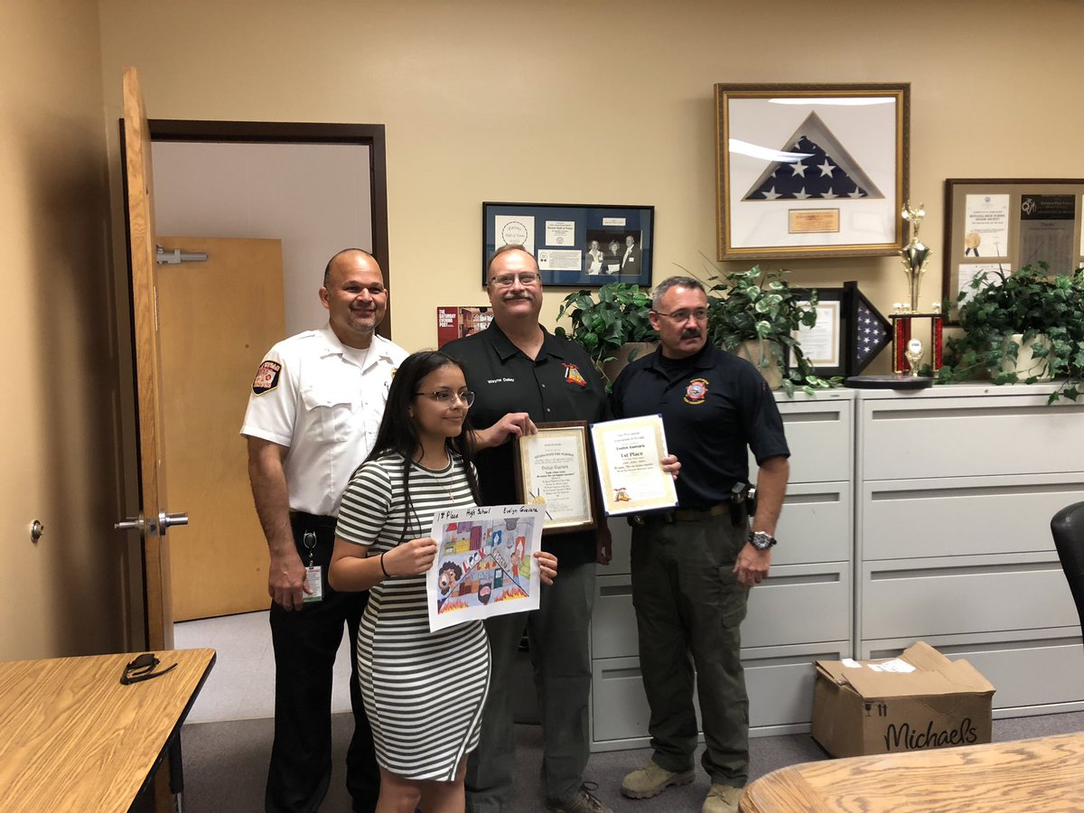 Battecm's tweet photo. Fire Science Academy student receiving her 1st place award for @NevadaDPS fire prevention week poster contest! She will have her poster on billboards all over @ClarkCountyNV and @NVGovernment https://t.co/6WrWuZRkKa