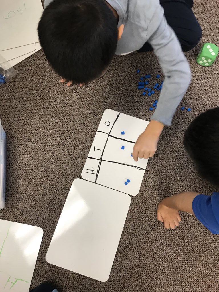 tzakas3's tweet photo. Today we placed “Trading Base Ten Blocks”....students rolled the die and added base tens on their board. As their numbers went up they traded ones for tens and then tens for hundreds. Their goal was to reach 100!!! #mathgames #basetenblocks #jlpsyrdsb #grades2/3 #room219 https://t.co/gWsJXYSu6C