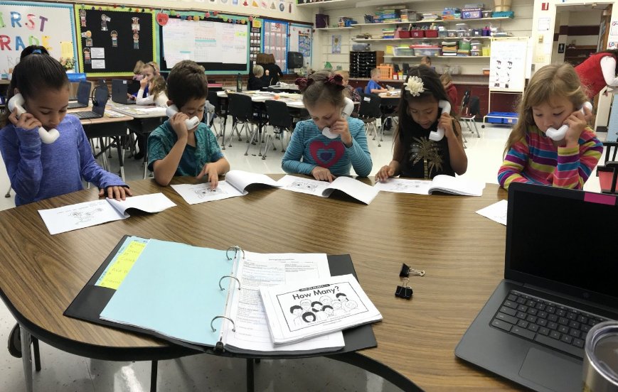 RyanHart2013's tweet photo. Two of Miss Ahsmann's small group reading teams working on their fluency by listening to their own reading voice in their whisper phones.  #ReadingFluency #ReadingReflection #wcusd200 https://t.co/mkeDc6TpvV