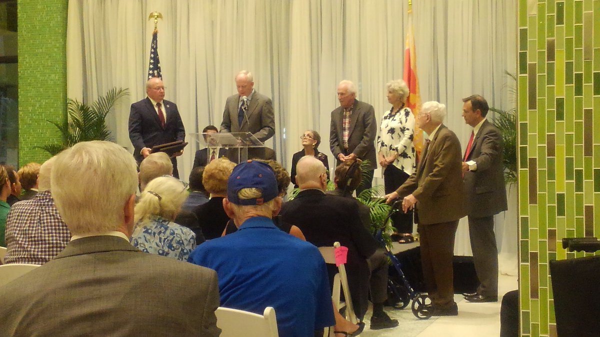 CityofJax's tweet photo. The current president and vice-president of City Council Aaron Bowman and Scott Wilson present a resolution to members of the original City Council following consolidation. #Jax50 https://t.co/3iExqN3HUT